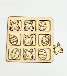 Wooden Tic Tac Toe Game with Easter Bunny and eggs pieces. 