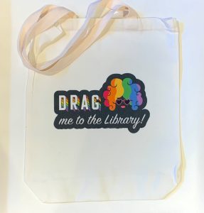 sublimation tote bag with rainbow drag me to the library design 